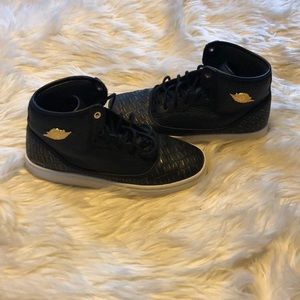 Jordan’s black and gold leather size 6.5 Y